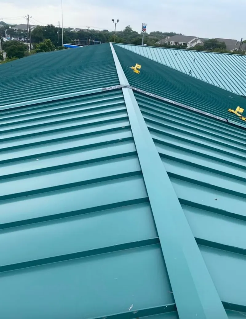 Green commercial metal roof ridge and valley for Metal Roof Repair in Brenham